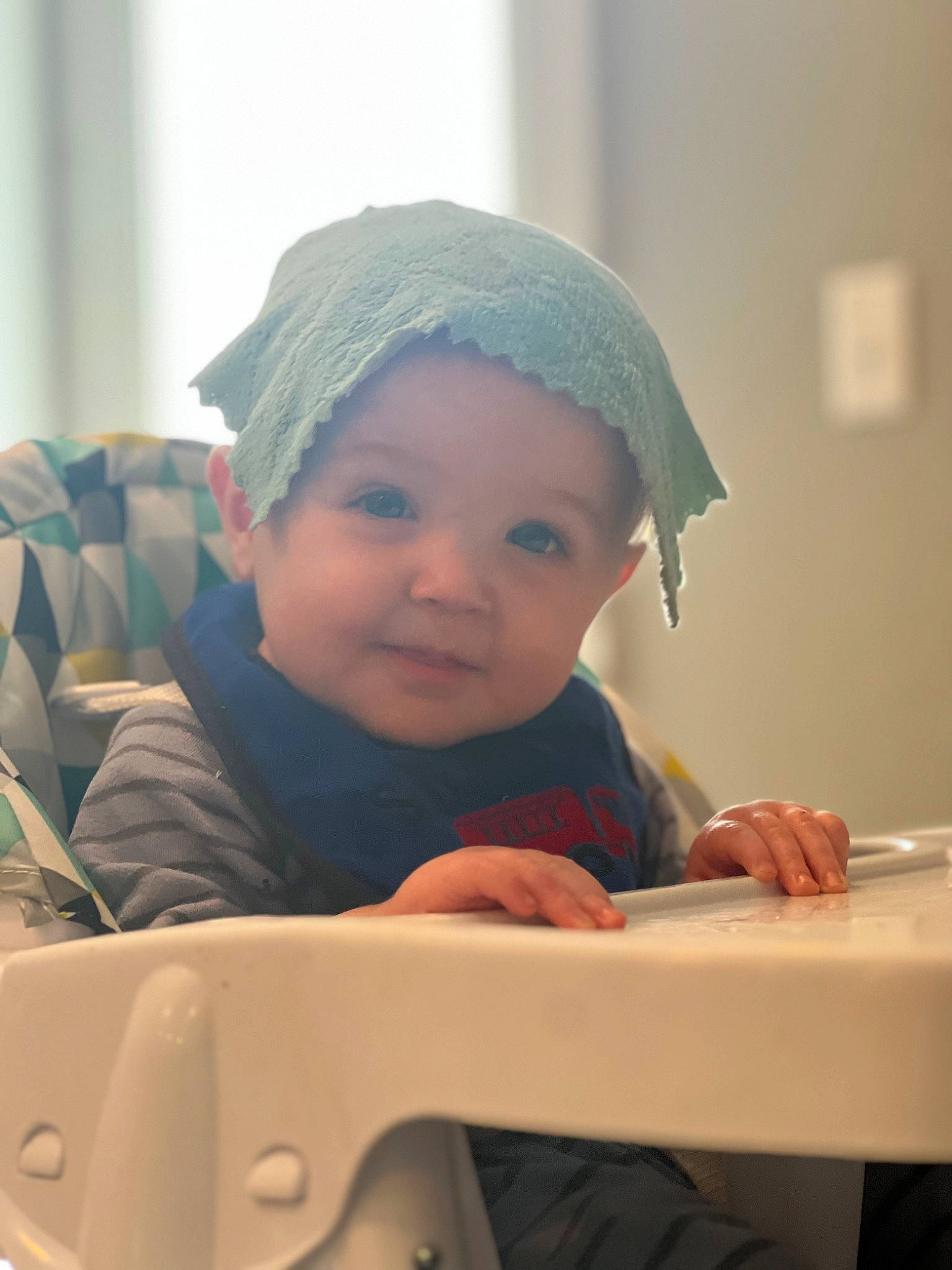 Dakota is registered to the contest to win money with this photo: baby, baby_toddler_clothing, cap, cheek, child, chin, comfort, eyebrow, face, facial_expression, fun, headgear, headwear, lip, nose, person, room, sitting, skin, sleeve