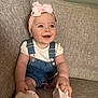 Nola joined the competition — help win amazing prizes! baby, child, smiling, headband, bow, denim_overalls, white_shirt, sitting, couch, indoor, cute, happy, blue_eyes, infant, sock, pink, pacifier, wooden_beads, furniture, portrait