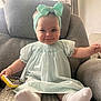 baby, child, smiling, headband, dress, armchair, toy, phone, socks, indoors, window, curtains, light, happy, cute, infant, seated, person, furniture, cozy