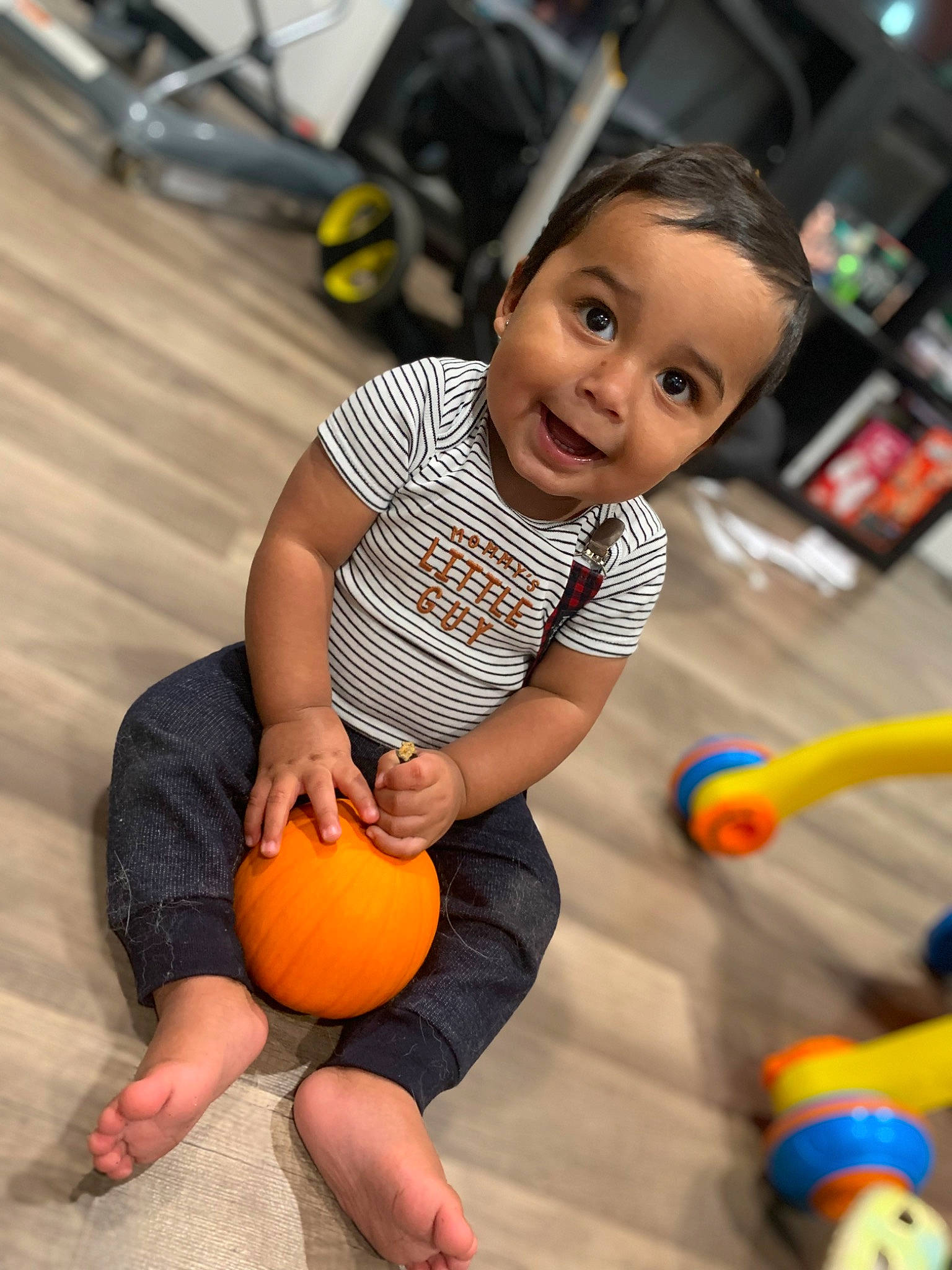 Angelo joined the competition — help win amazing prizes! ball, calabaza, child, dress, face, flooring, fun, gourd, happy, leisure, natural_foods, orange, person, photograph, pumpkin, shorts, smile, thigh, toddler, vegetable