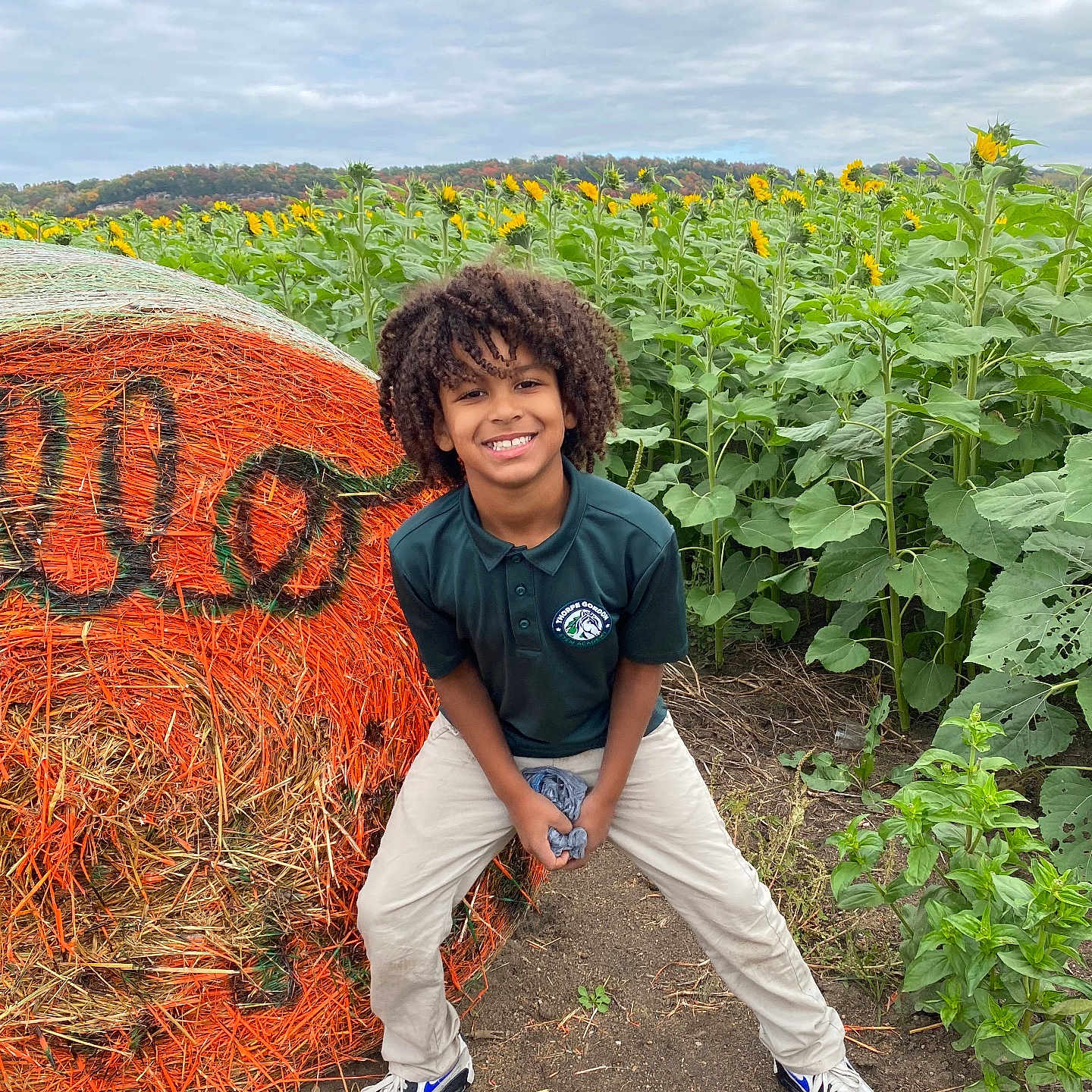 Avory is registered to the contest to win money with this photo: boy, child, clothing, curlyhair, face, field, flower, footwear, hair, head, herbal, herbs, male, nature, outdoors, person, photography, plant, portrait, shoe