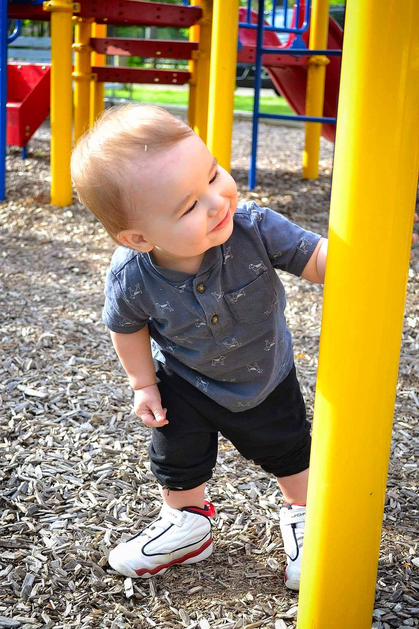 Zayden joined the competition — help win amazing prizes! baby, baby_toddler_clothing, child, city, electric_blue, facial_expression, fun, grass, happy, leisure, outdoor_play_equipment, people_in_nature, person, playground, public_space, recreation, shorts, smile, t_shirt, toddler