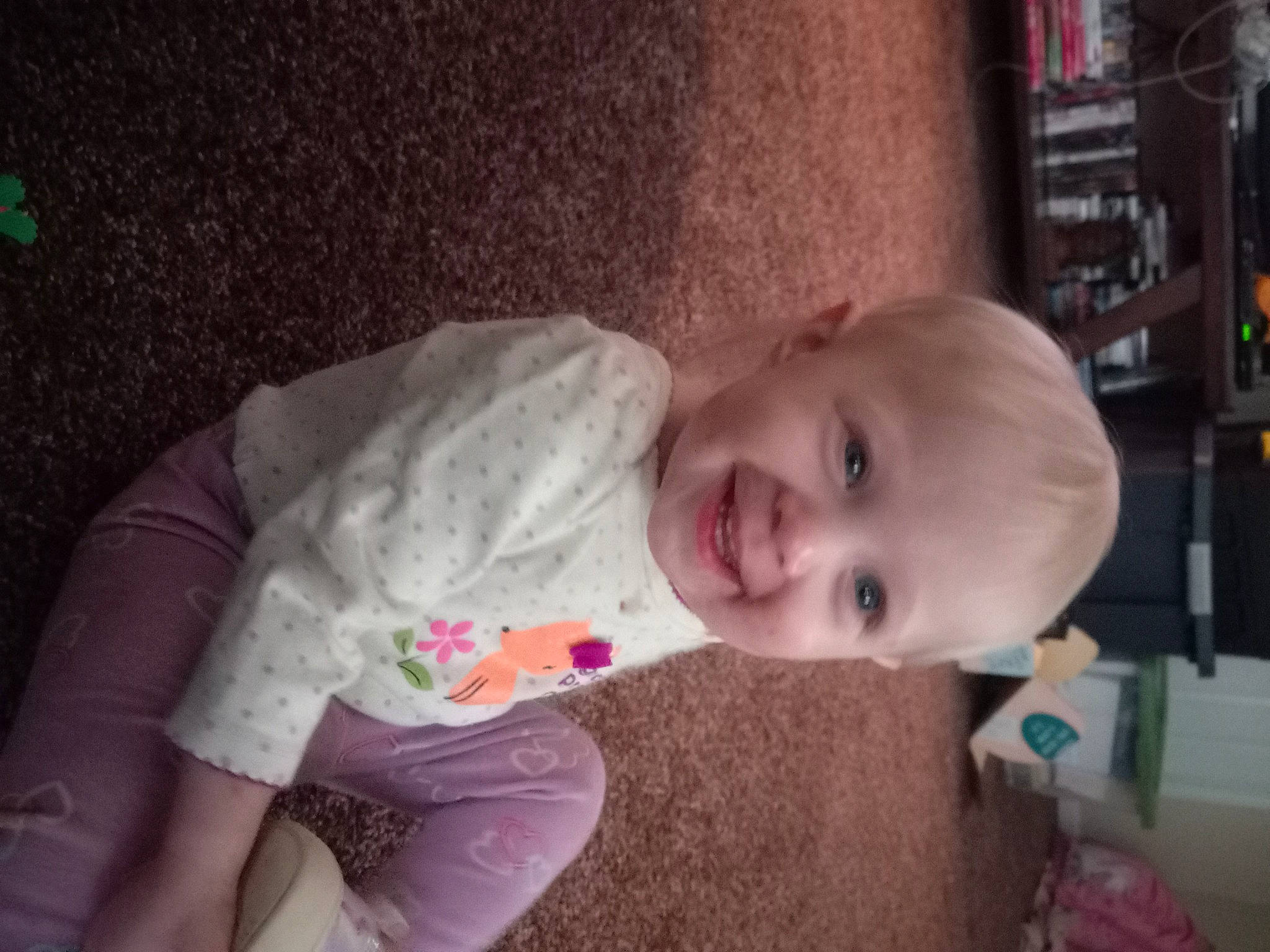 Kara joined the competition — help win amazing prizes! baby, baby_laughing, baby_toddler_clothing, cheek, child, comfort, fun, happy, iris, joy, laugh, nose, person, room, shelf, sitting, skin, sleeve, smile, toddler