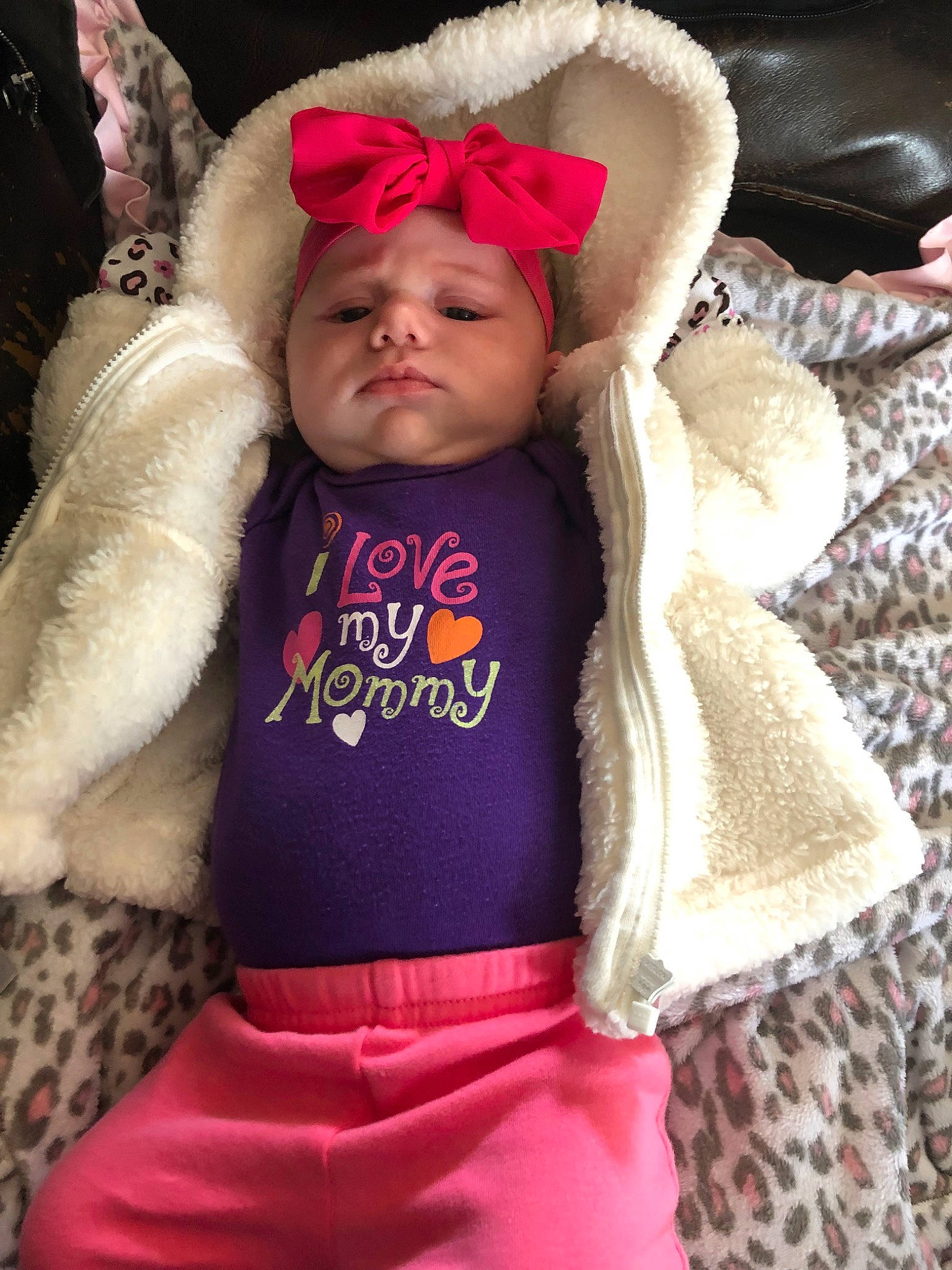 Kamari is registered to the contest to win money with this photo: baby, cheek, child, clothing, costume_accessory, ear, fur, fur_clothing, head, headgear, hoodie, magenta, organ, outerwear, person, pink, purple, skin, toddler