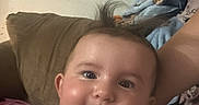 Deliah joined the competition — help win amazing prizes! baby, blanket, child, clothing, couch, cute, decor, face, hair, happy, home, indoor, infant, person, pink_shirt, portrait, room, seated, smiling, young_child