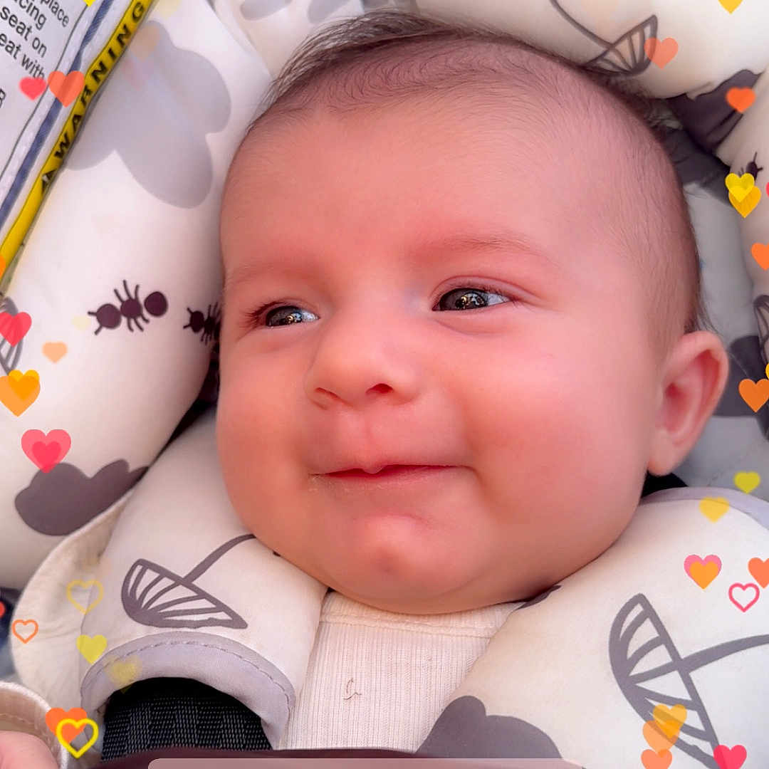 Deliah joined the competition — help win amazing prizes! baby, smiling, face, infant, cushion, seat, pattern, ant, umbrella, heart_overlay, text_overlay, comfort, cute, closeup, portrait, child, happy, indoors, soft, warm