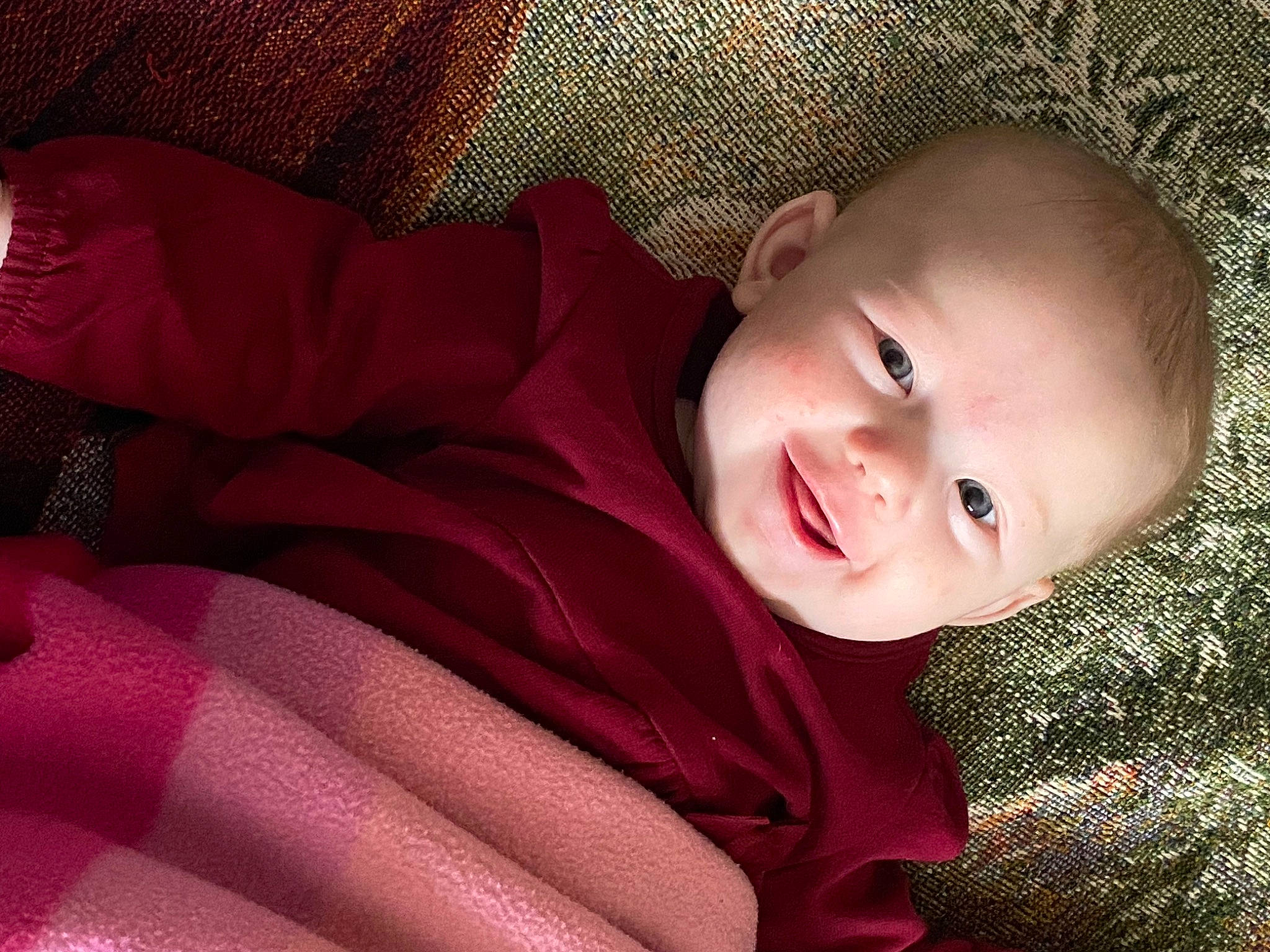 Kyra is registered to the contest to win money with this photo: baby, baby_toddler_clothing, cheek, comfort, eye, eyebrow, flash_photography, grass, happy, head, human_body, iris, lip, mouth, nose, person, skin, sleeve, smile, textile