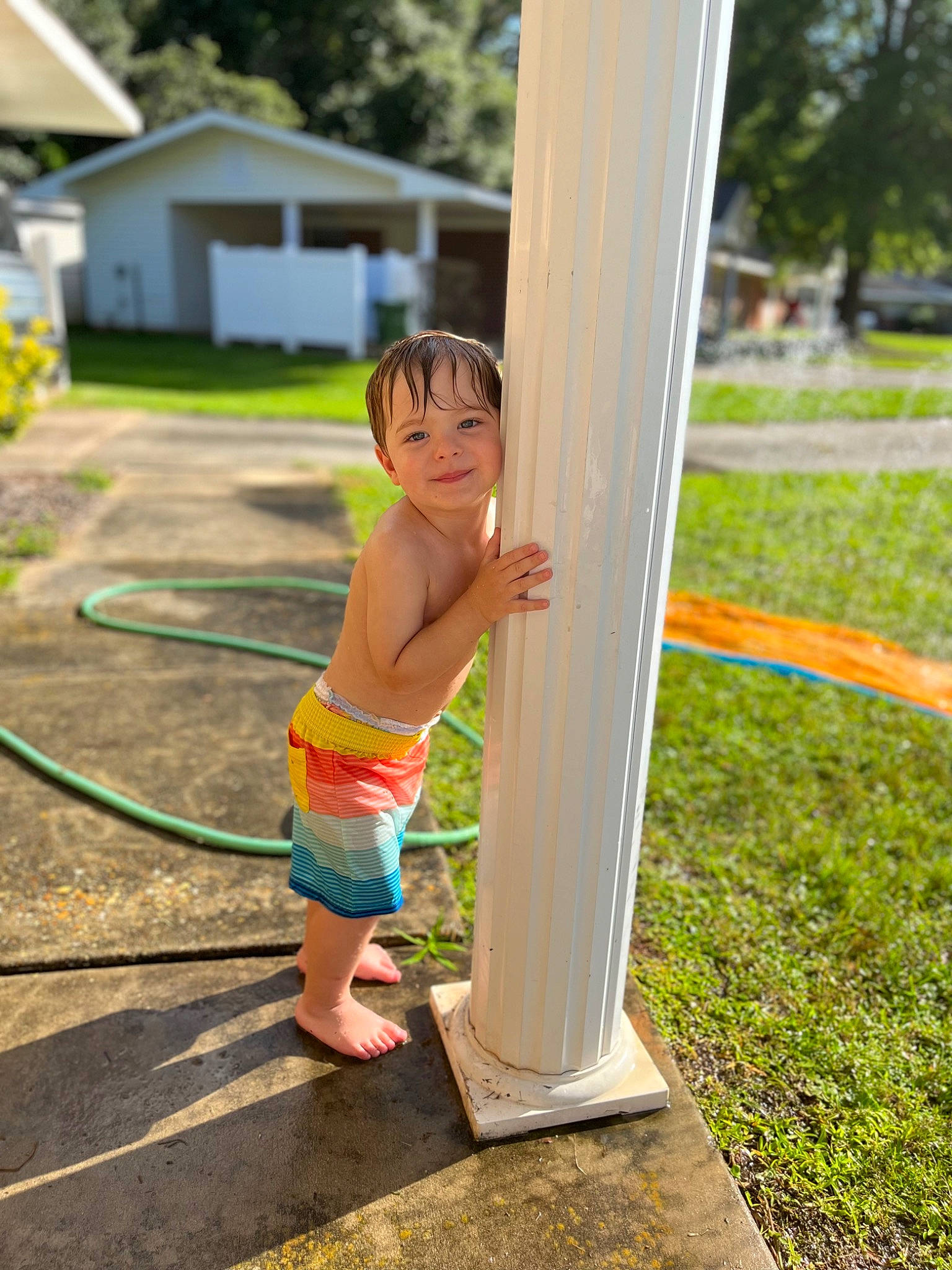 Phoenix joined the competition — help win amazing prizes! backyard, barefoot, calf, child, fun, grass, happy, house, human_leg, joy, leisure, people_in_nature, person, plant, play, recreation, shorts, swimwear, toddler, tree