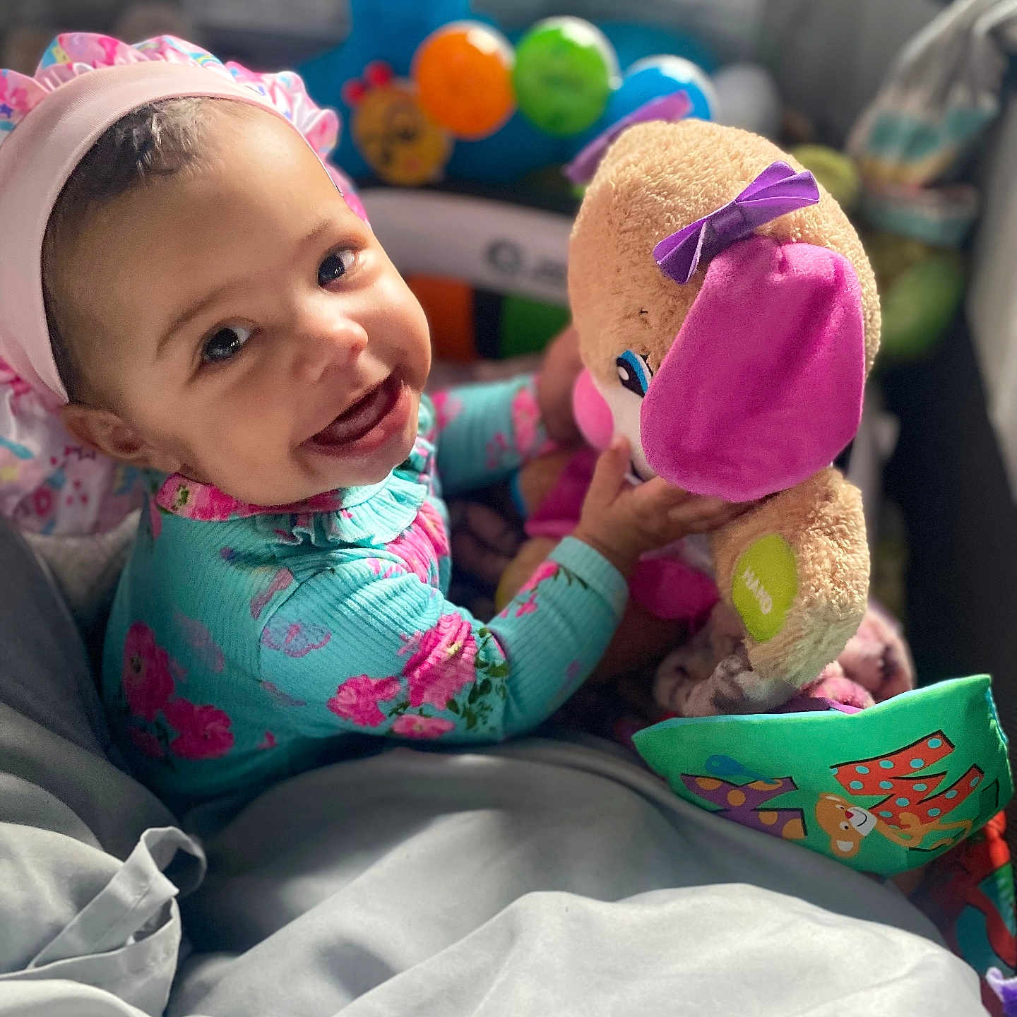 Olivia joined the competition — help win amazing prizes! baby, ball, bed, clothing, couch, cushion, face, furniture, happy, hat, head, homedecor, person, photography, portrait, smile, sport, tennis, tennisball, toy
