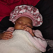 Zora is registered to the contest to win money with this photo: baby, sleeping, blanket, pink, bonnet, hand, face, cozy, soft, infant, cute, child, rest, warm, wrapped, peaceful, portrait, indoor, closeup, newborn