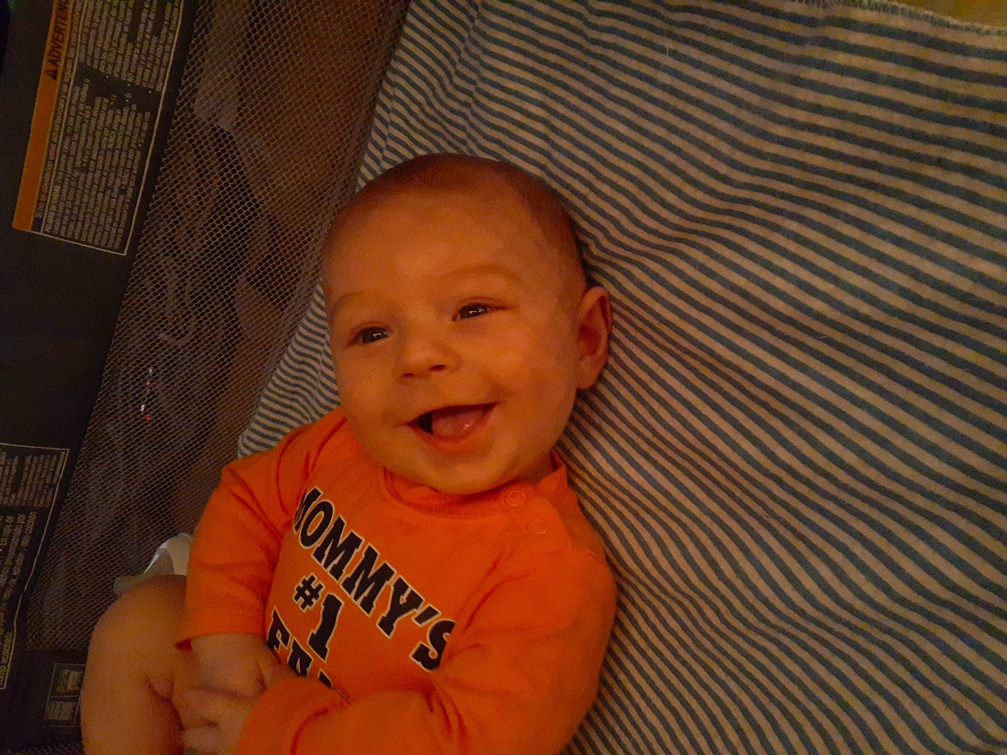 Jaden is registered to the contest to win money with this photo: baby, baby_laughing, baby_toddler_clothing, cheek, eye, face, finger, flooring, fun, gesture, happy, head, iris, nose, person, skin, sleeve, smile, thumb, toddler