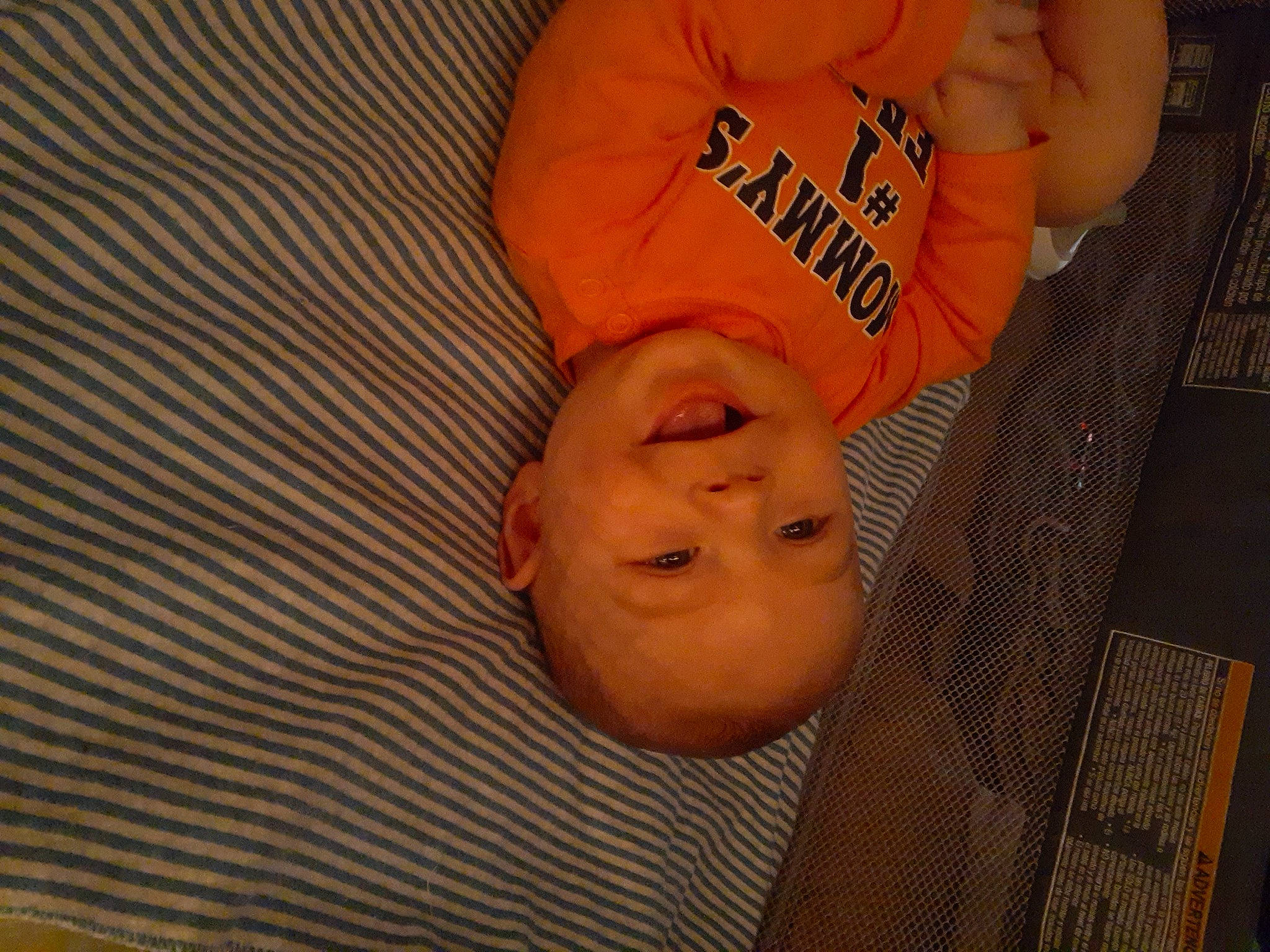 Jaden joined the competition — help win amazing prizes! baby, baby_toddler_clothing, bedtime, cheek, child, comfort, flooring, fun, gesture, happy, linens, orange, pattern, person, sleep, sleeve, smile, t_shirt, thumb, toddler