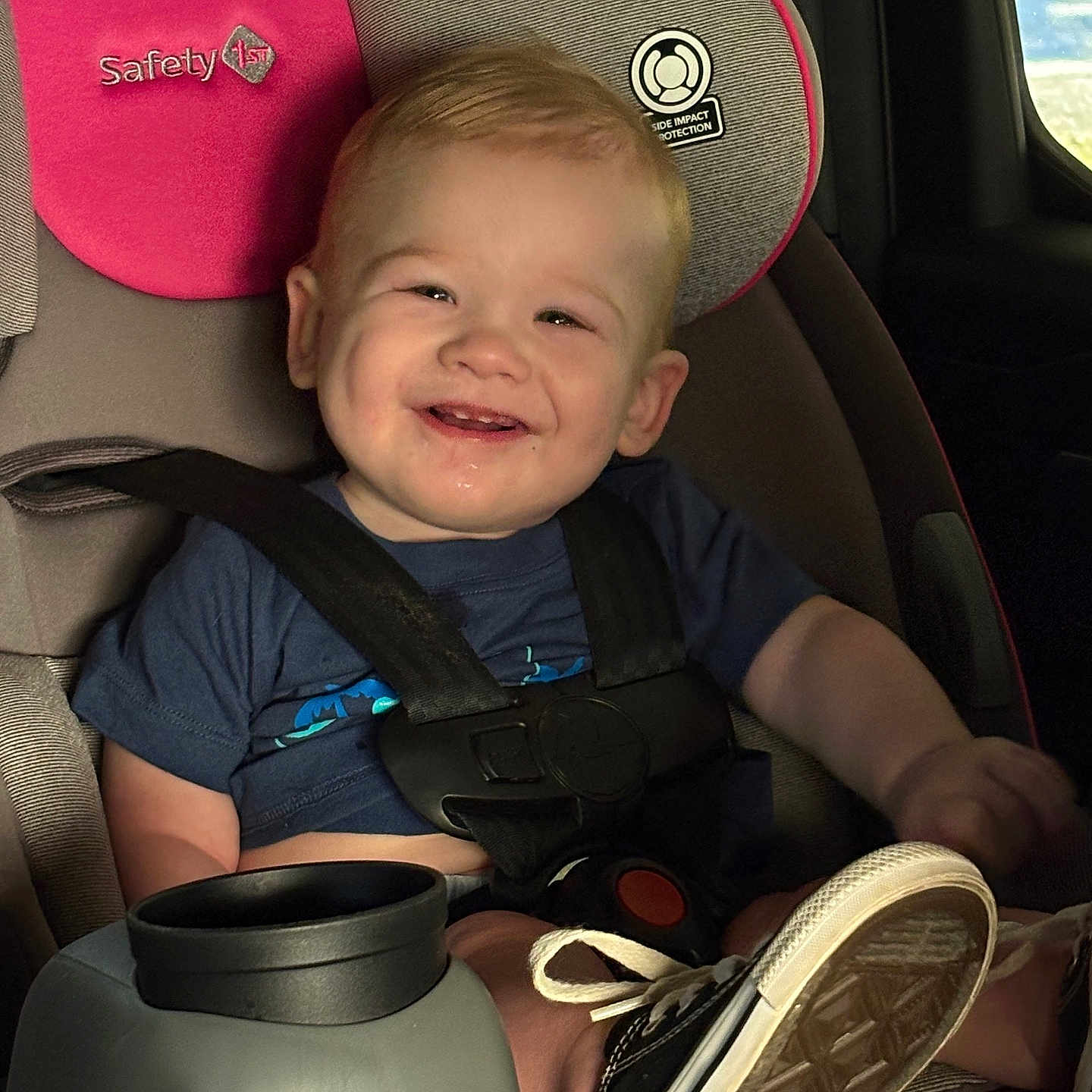 Talon joined the competition — help win amazing prizes! baby, blue_shirt, car_interior, car_seat, child, cute, drool, footwear, happy, portrait, safety, seat, seatbelt, smiling, sneakers, strapped_in, sunlight, toddler, window, young_child
