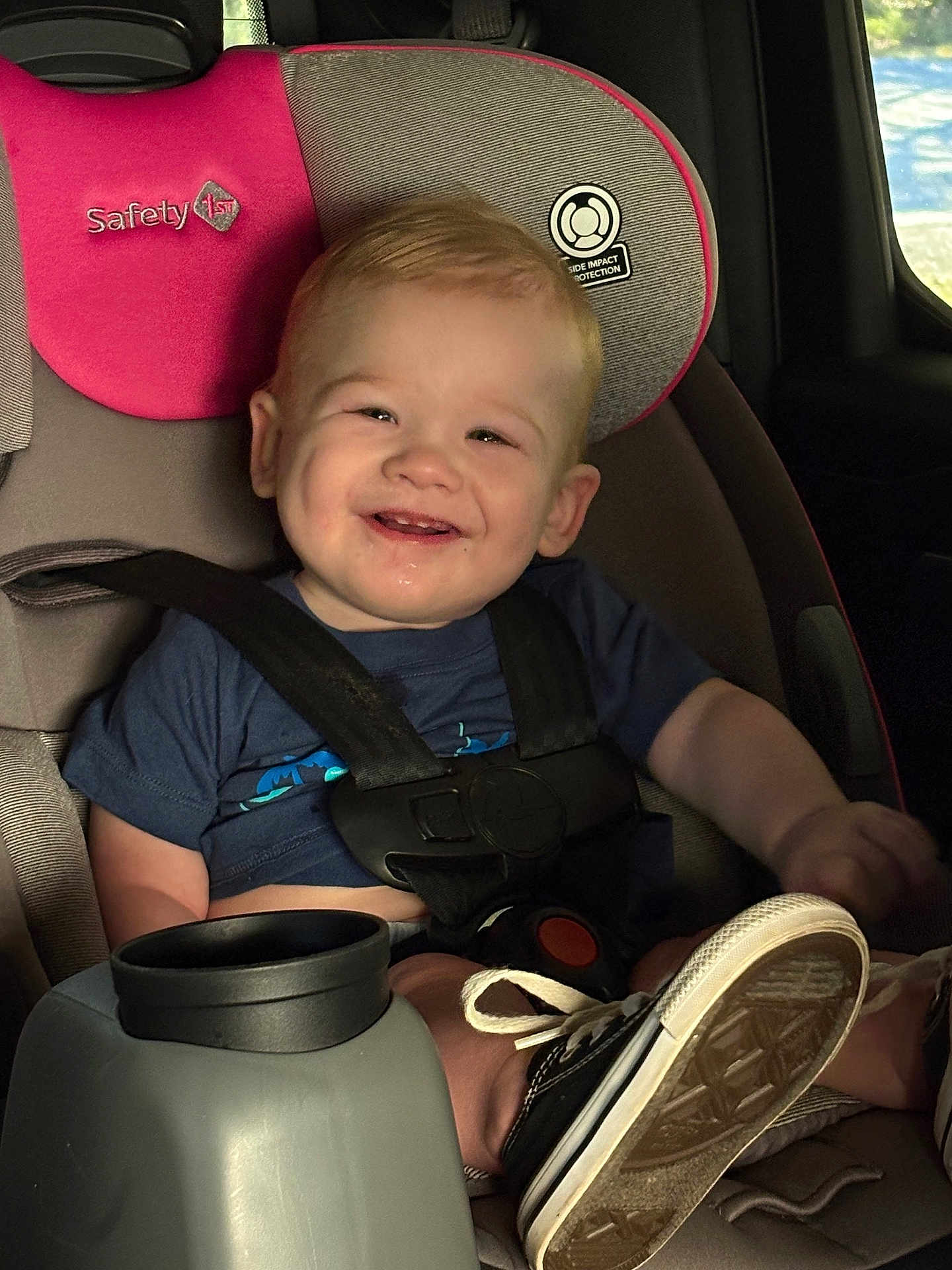 Talon joined the competition — help win amazing prizes! toddler, child, car_seat, smiling, happy, baby, seatbelt, footwear, sneakers, blue_shirt, car_interior, sunlight, window, seat, safety, drool, cute, young_child, strapped_in, portrait