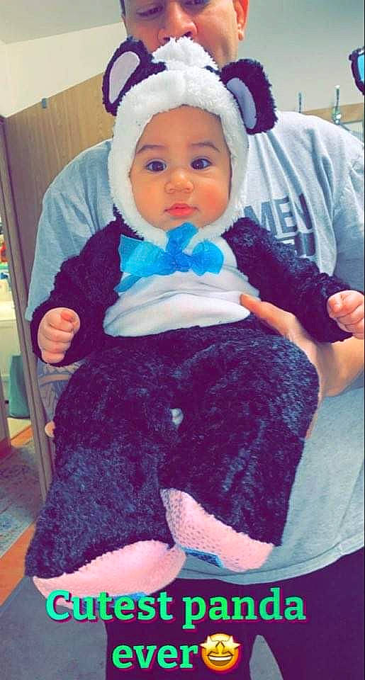 Giannah is registered to the contest to win money with this photo: baby, baby_toddler_clothing, bonnet, child, costume, costume_accessory, costume_hat, embellishment, fictional_character, hair_accessory, hand, headband, headwear, lap, person, photo_caption, sock, toddler