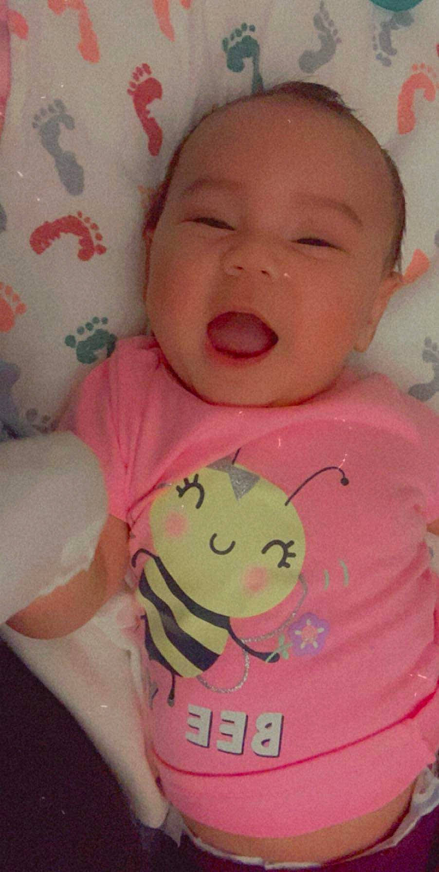 Giannah is registered to the contest to win money with this photo: baby, baby_products, baby_toddler_clothing, cheek, child, eyebrow, facial_expression, iris, lip, organ, peach, person, pink, skin, toddler, tongue