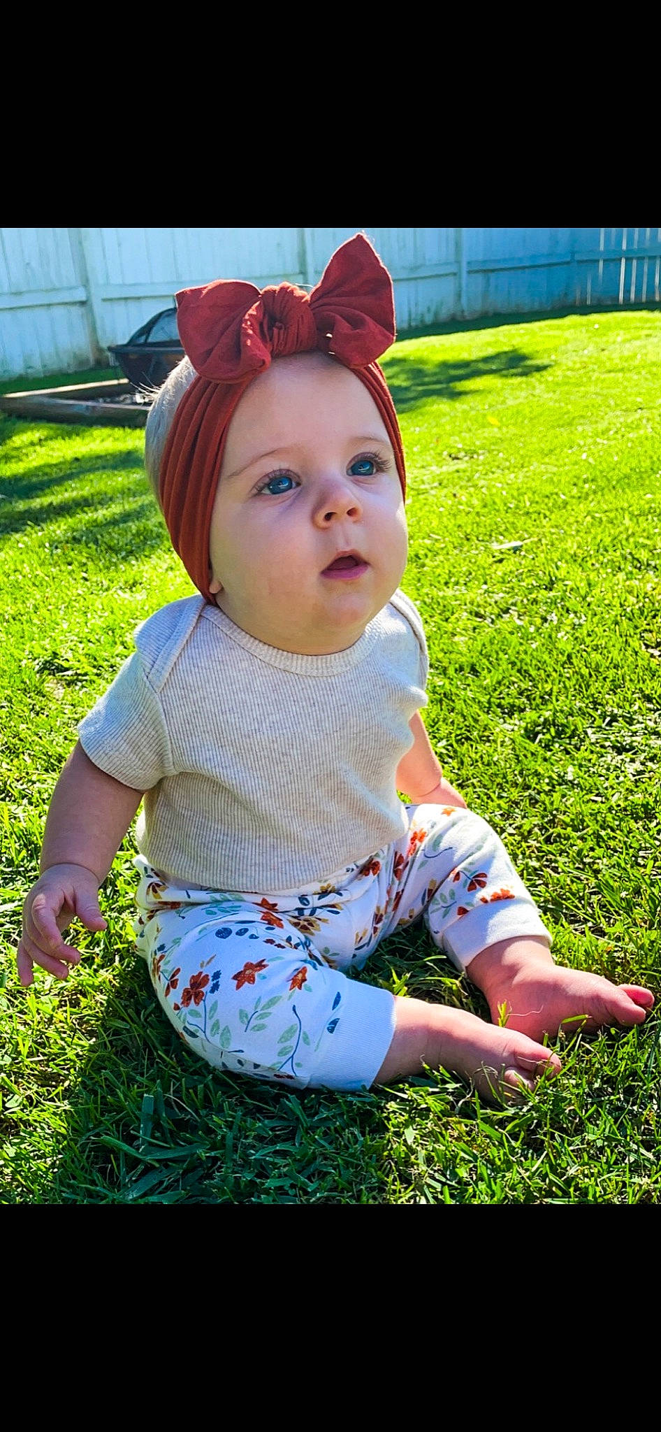 Aria is registered to the contest to win money with this photo: baby, baby_toddler_clothing, botany, child, fun, grass, happy, lawn, leaf, lip, pattern, people_in_nature, person, pink, plant, red, skin, sleeve, sunlight, t_shirt