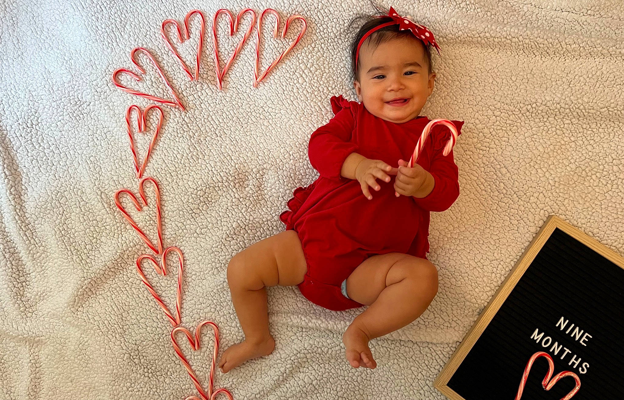 Ivey joined the competition — help win amazing prizes! baby, baby_toddler_clothing, barefoot, child, comfort, costume_hat, design, finger, flooring, foot, happy, human_leg, joy, pattern, person, room, sitting, sleeve, smile, sock