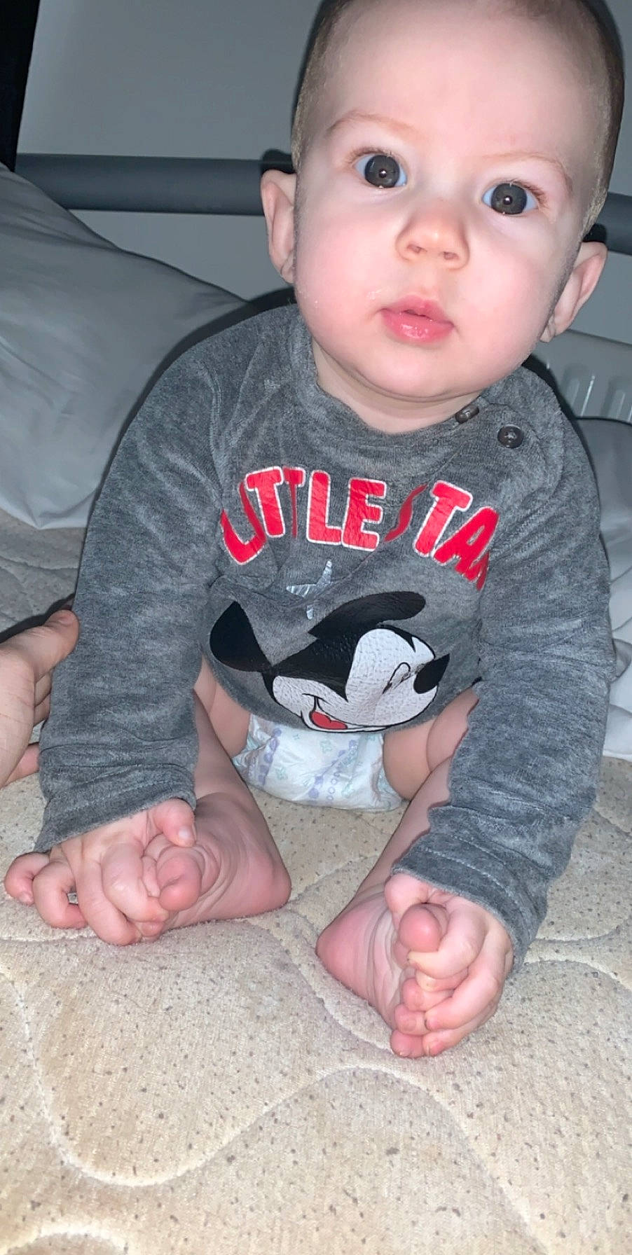 Kobi is registered to the contest to win money with this photo: arm, baby, cheek, child, finger, leg, person, sitting, skin, toddler