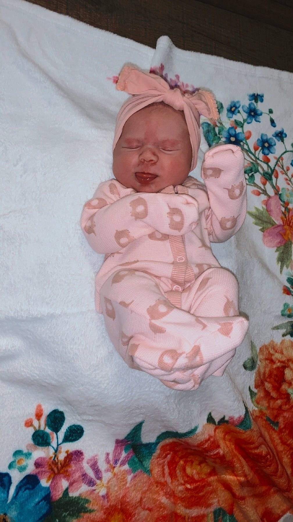 Oakley is registered to the contest to win money with this photo: art, baby, baby_products, baby_toddler_clothing, bedding, cheek, child, comfort, doll, headwear, linens, pattern, peach, person, petal, pink, rose, sitting, sleeve, textile