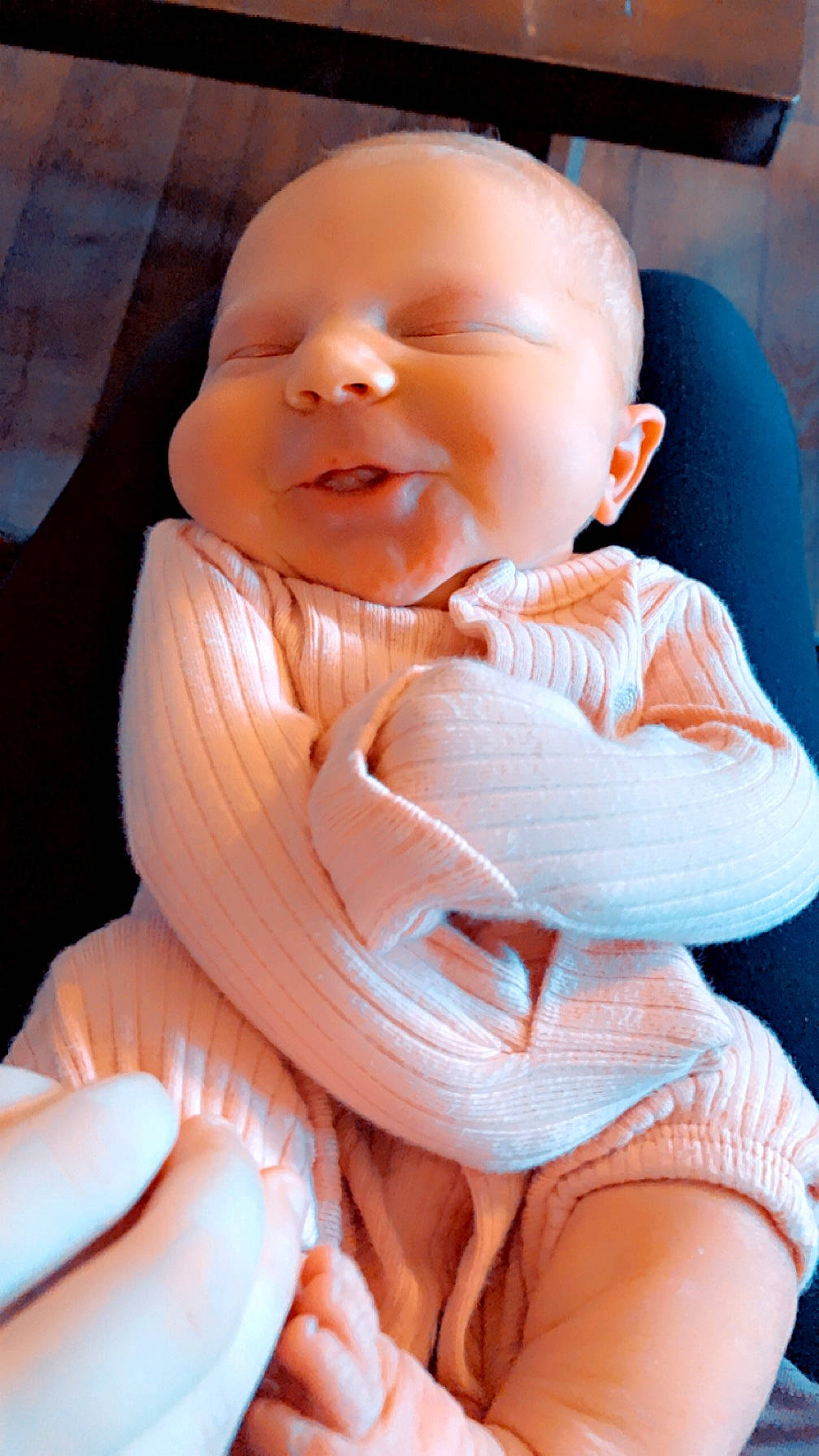 Oakley joined the competition — help win amazing prizes! baby, baby_products, baby_toddler_clothing, cheek, comfort, face, facial_expression, finger, head, human_body, mouth, neck, orange, person, pink, skin, smile, textile, thigh, thumb
