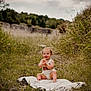 baby, child, grass, outdoor, blanket, nature, happy, smiling, clapping, infant, grassland, field, sunlight, portrait, young_child, one_year_old, cute, sitting, casual_clothing, daytime
