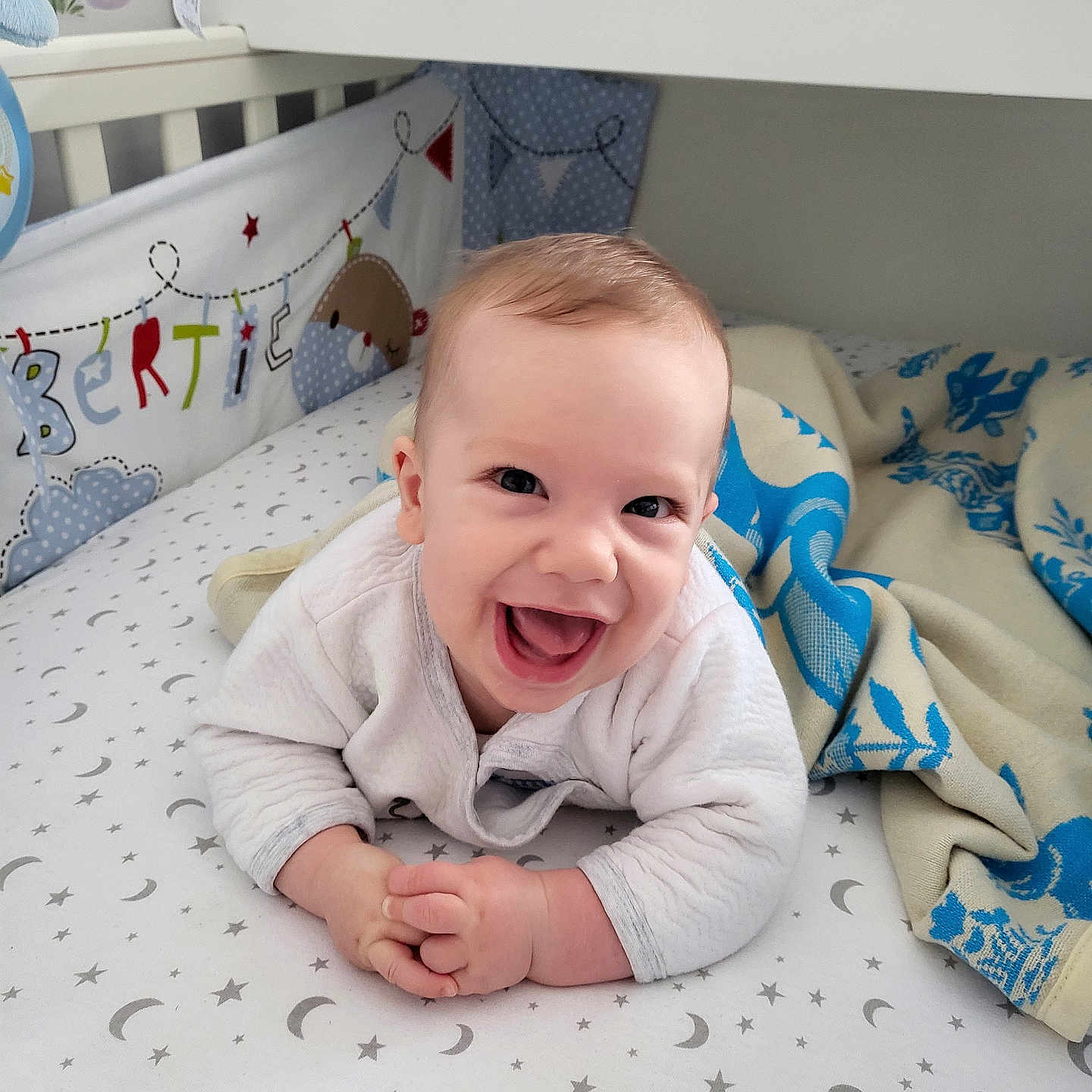 Robert joined the competition — help win amazing prizes! baby, babylaughing, bed, blanket, crib, cushion, face, furniture, happy, head, homedecor, indoors, infantbed, laughing, nursery, person, photography, portrait, quilt, toy