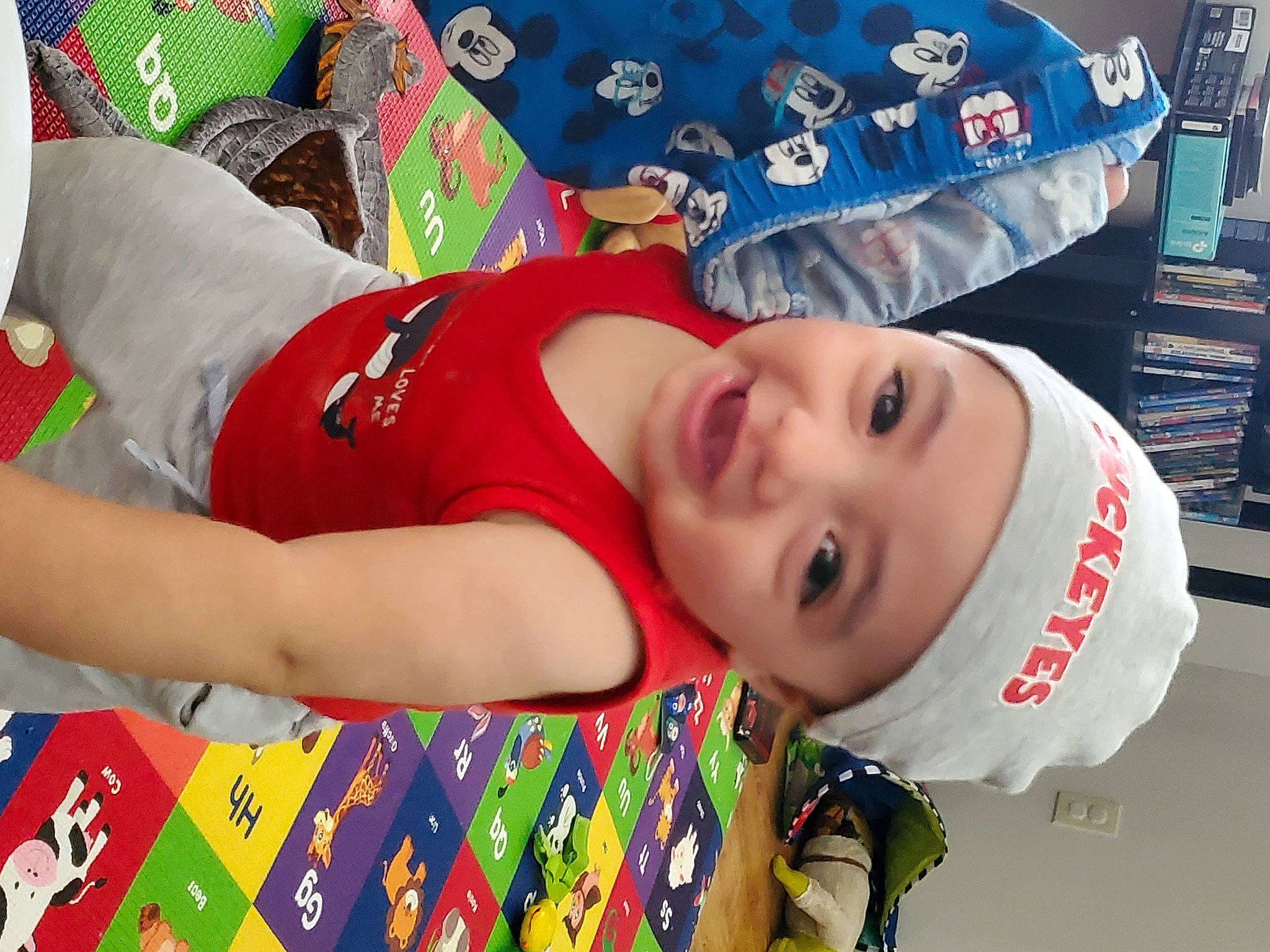 Jovanni joined the competition — help win amazing prizes! blue, child, elbow, event, face, fun, happy, hat, headwear, joy, leisure, mouth, pattern, person, portrait_photography, recreation, sleeve, smile, summer, t_shirt