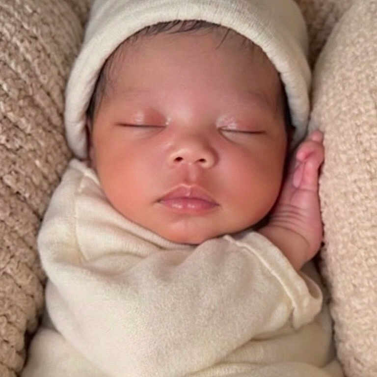 Kyomi is registered to the contest to win money with this photo: baby, child, closed_eyes, comfort, cozy, cute, face, hand, hat, infant, knit_background, newborn, peaceful, portrait, resting, skin, sleeping, soft_fabric, swaddled, warm