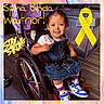 Mazikeen joined the competition — help win amazing prizes! child, denim_dress, disability_awareness, happy, home, indoor, photography, portrait, purple_socks, rainbow_wheels, seated, short_hair, smiling, sneakers, striped_shirt, supportive_seating, text_overlay, toddler, wheelchair, yellow_ribbon