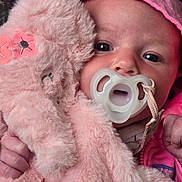 Cora joined the competition — help win amazing prizes! baby, bodypart, bonnet, cap, clothing, coat, face, finger, hand, hat, head, hood, hoodie, jacket, knitwear, person, photography, portrait, sweater, toy