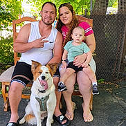 Charlie joined the competition — help win amazing prizes! family, man, woman, baby, dog, outdoor, greenery, tree, leafy, sunlight, smiling, seated, casual_clothing, shoes, chair, pavement, nature, happy, portrait, together