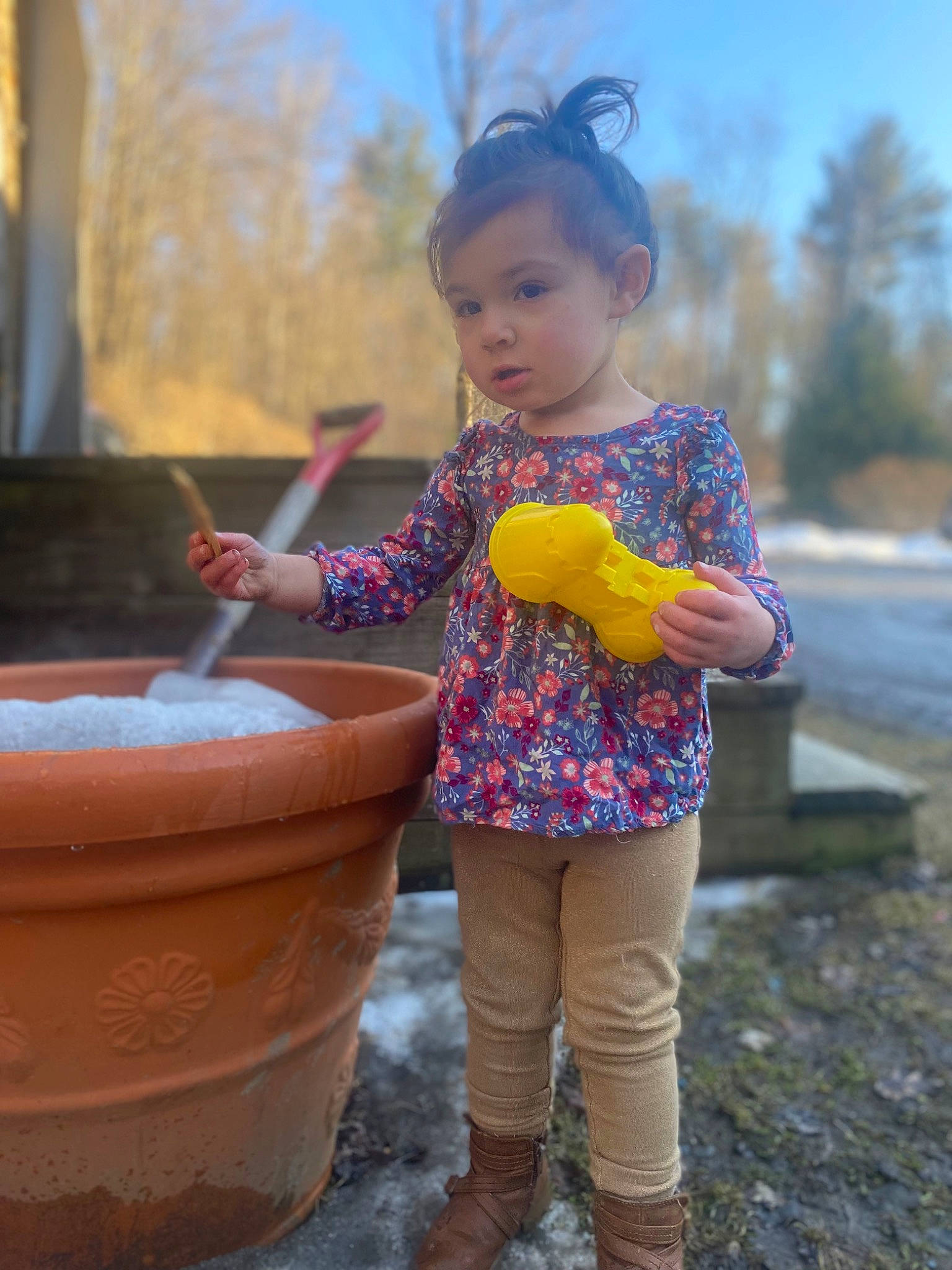 Lylah is registered to the contest to win money with this photo: baby_toddler_clothing, beauty, child, flowerpot, fun, grass, hair, hairstyle, happy, head, human_body, leisure, orange, person, pink, plant, public_space, sky, sleeve, toddler