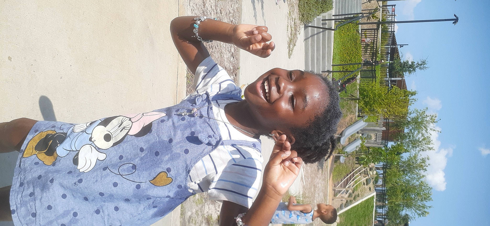 Nyota is registered to the contest to win money with this photo: adaptation, child, elbow, eyewear, fun, grass, happy, jewellery, joy, laugh, leisure, pattern, people_in_nature, person, plant, smile, t_shirt, tree, vacation, water