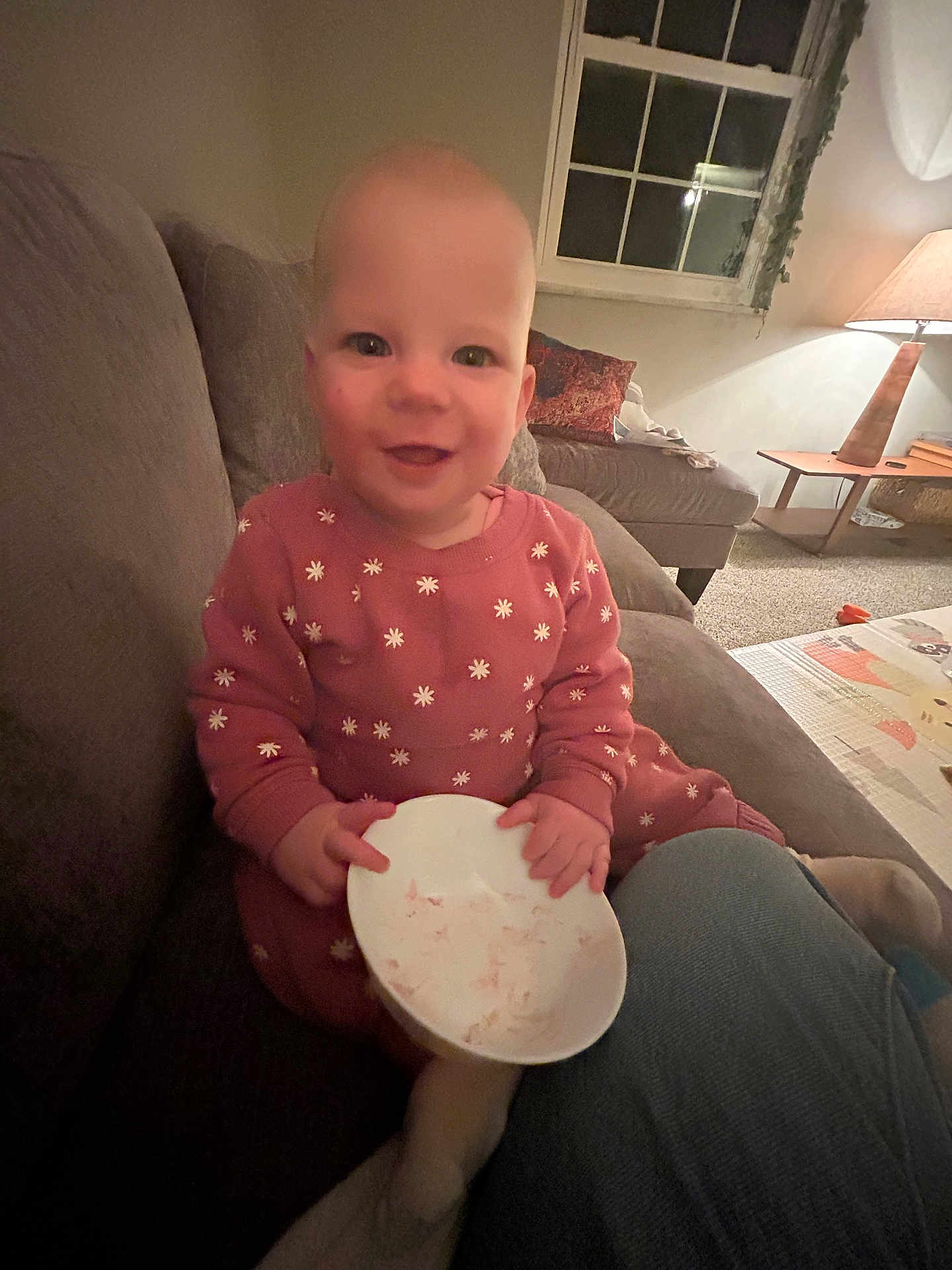 Ellie is registered to the contest to win money with this photo: architecture, baby, building, couch, cushion, cutlery, face, food, furniture, head, homedecor, indoors, livingroom, meal, person, photography, portrait, room, sitting, spoon