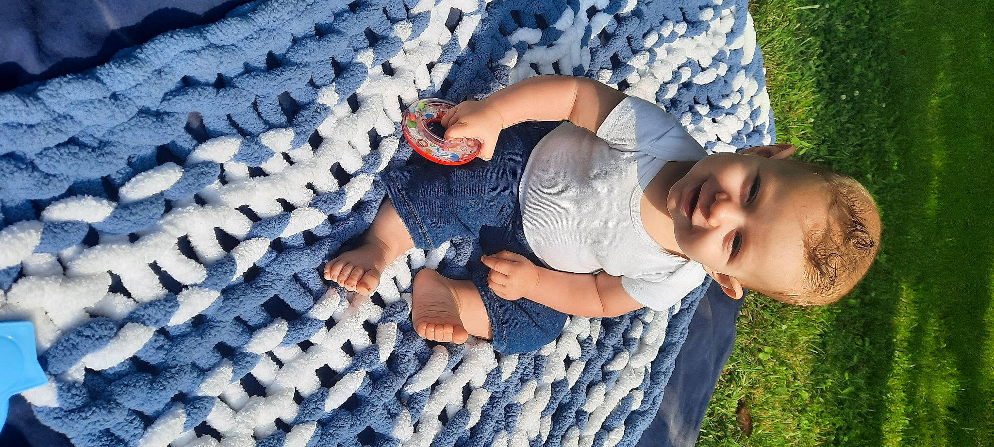 Memphis is registered to the contest to win money with this photo: azure, blue, child, electric_blue, fun, grass, happy, hat, joy, leisure, linens, pattern, people_in_nature, person, plant, sitting, smile, t_shirt, toddler, tree