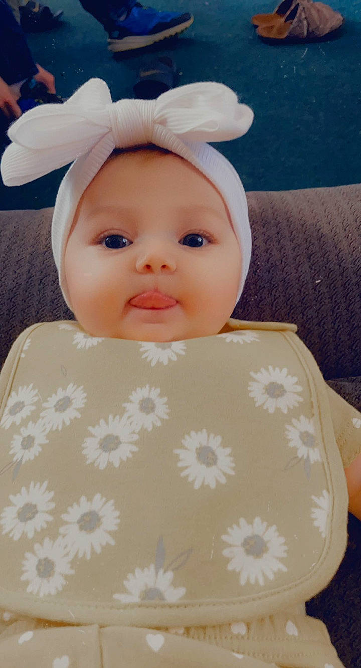 Alexandria joined the competition — help win amazing prizes! baby, baby_toddler_clothing, cap, cheek, costume_hat, eye, eyebrow, eyelash, happy, headband, headwear, iris, linens, pattern, person, product, skin, sleeve, smile, textile