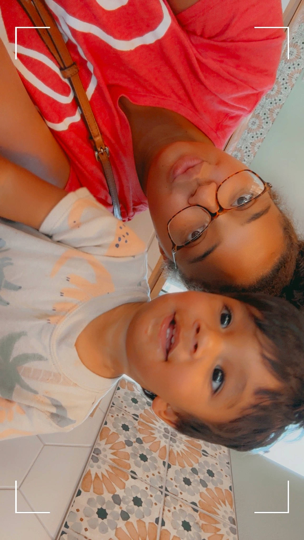 Hendrix is registered to the contest to win money with this photo: cheek, child, eyelash, eyewear, facial_expression, fun, gesture, glasses, happy, joy, lip, mouth, neck, nose, pattern, peach, person, skin, smile, toddler