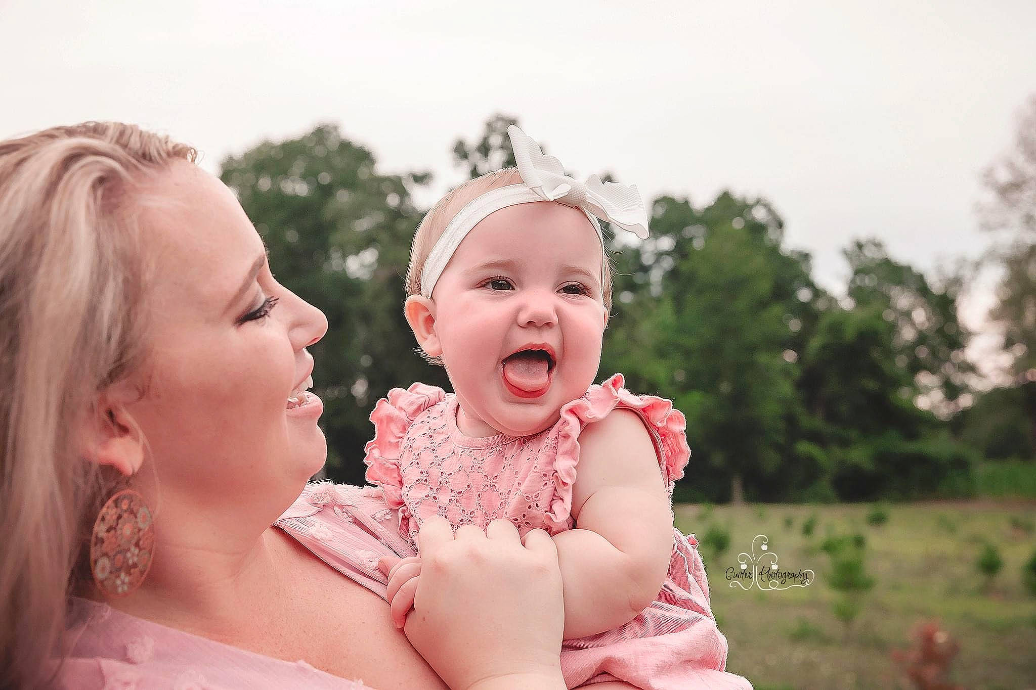 Ansley is registered to the contest to win money with this photo: baby, cheek, child, facial_expression, family, fun, grass, happy, laugh, love, mouth, nose, people, people_in_nature, person, photograph, photography, pink, skin, smile