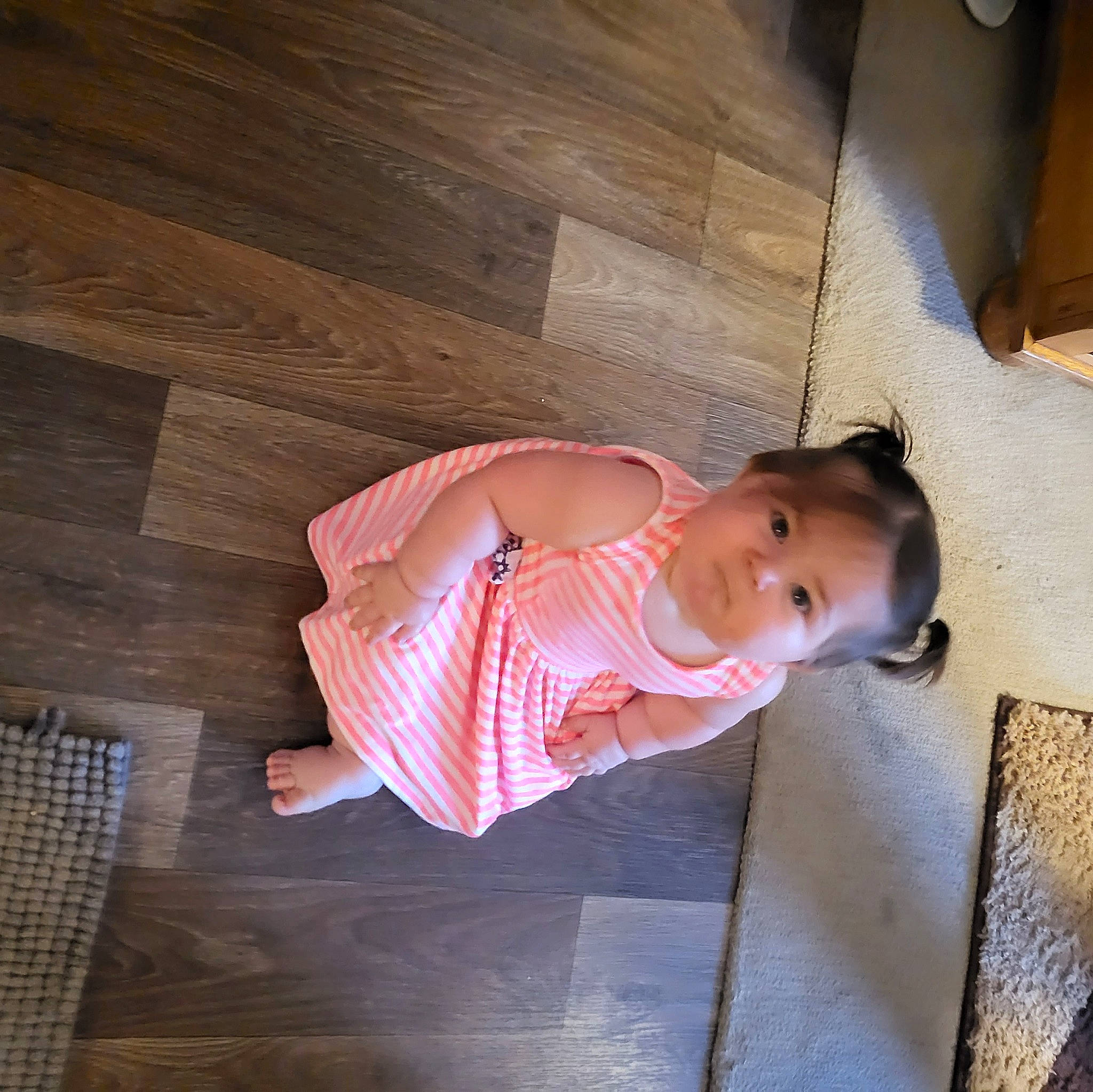 Jayla is registered to the contest to win money with this photo: baby, baby_products, baby_toddler_clothing, child, floor, flooring, happy, hardwood, human_leg, person, plank, plywood, room, sitting, sleeve, tints_and_shades, toddler, varnish, wood, wood_flooring