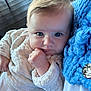 Charlie participe au concours pour gagner de l'argent avec cette photo : baby, infant, blue_eyes, cream_sweater, knit_blanket, portrait, close_up, hand, fingers, cheeks, gaze, indoors, wooden_floor, soft_texture, chunky_knit, blue_color, cute, cozy, skin, clothing