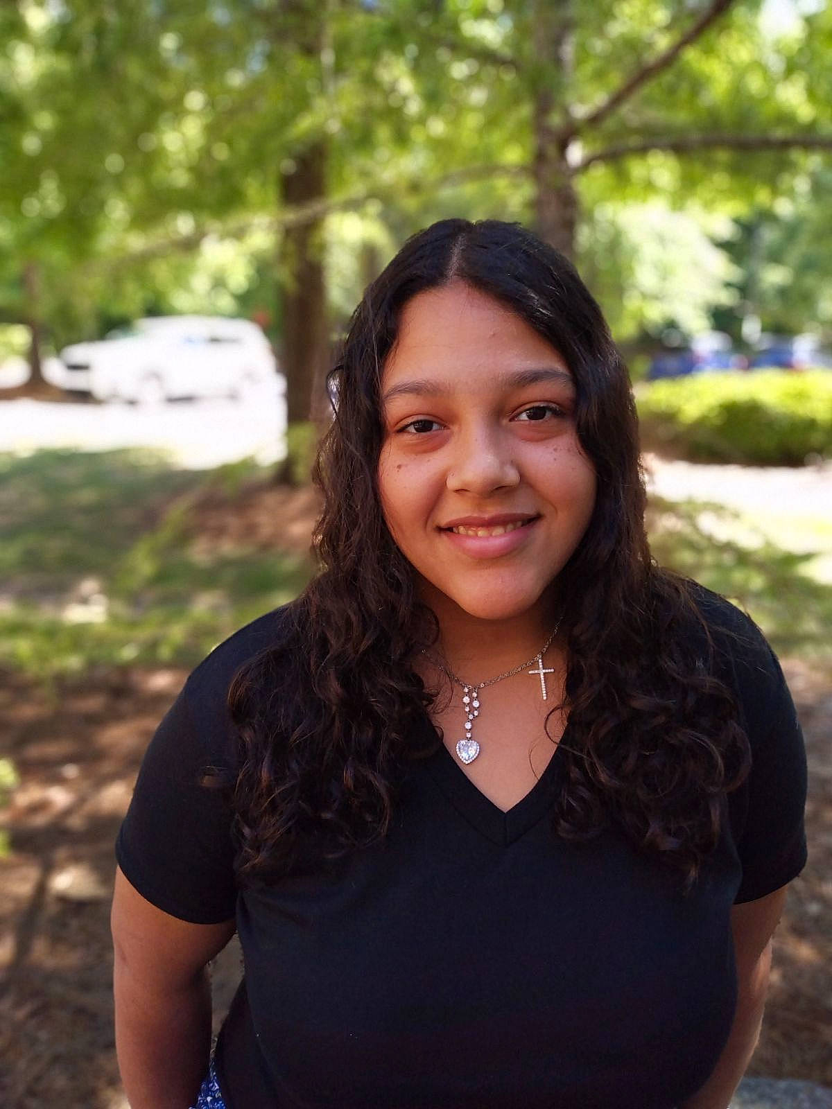 Jayla is registered to the contest to win money with this photo: black_hair, eyebrow, flash_photography, formal_wear, grass, happy, iris, jewellery, joy, layered_hair, leaf, leisure, lip, long_hair, necklace, people_in_nature, person, plant, shoulder, skin