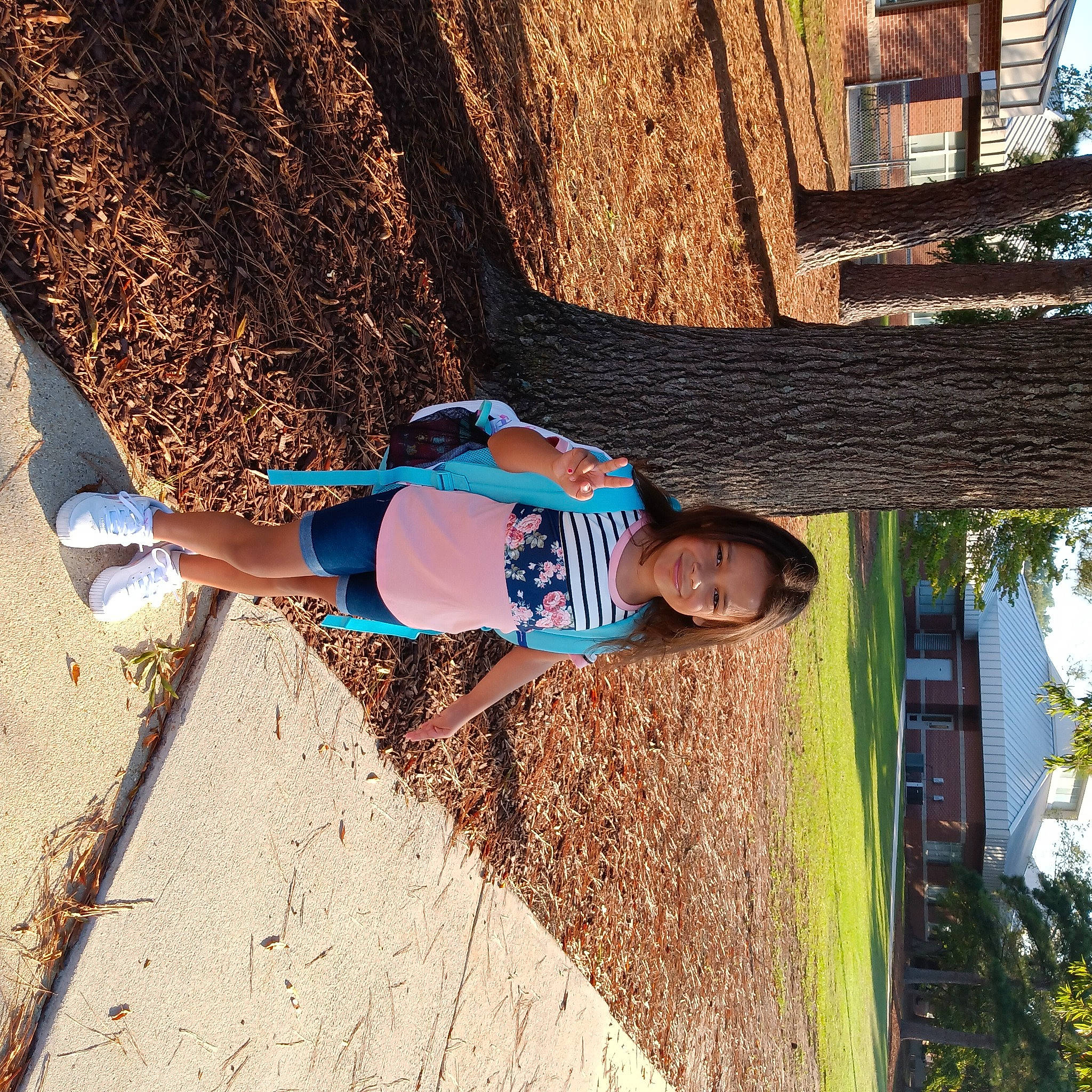 Londyn is registered to the contest to win money with this photo: azure, child, electric_blue, fun, grass, happy, house, human_leg, joy, landscape, leisure, people_in_nature, person, plant, shadow, soil, t_shirt, tints_and_shades, tree, vacation