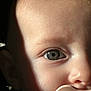Zely participe au concours pour gagner de l'argent avec cette photo : baby, infant, child, close_up, eye, iris, pupil, pacifier, mouth, cheek, forehead, skin, eyelashes, nostril, lighting, shadow, face, portrait, curious, soft_texture
