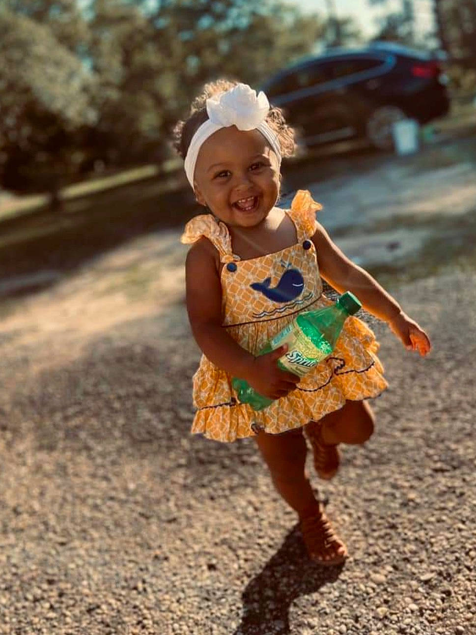 Kynsleigh is registered to the contest to win money with this photo: baby, child, child_model, dress, fashion_accessory, fun, hair_accessory, happy, headgear, headwear, joy, pattern, people, person, photography, plant, play, recreation, smile, toddler