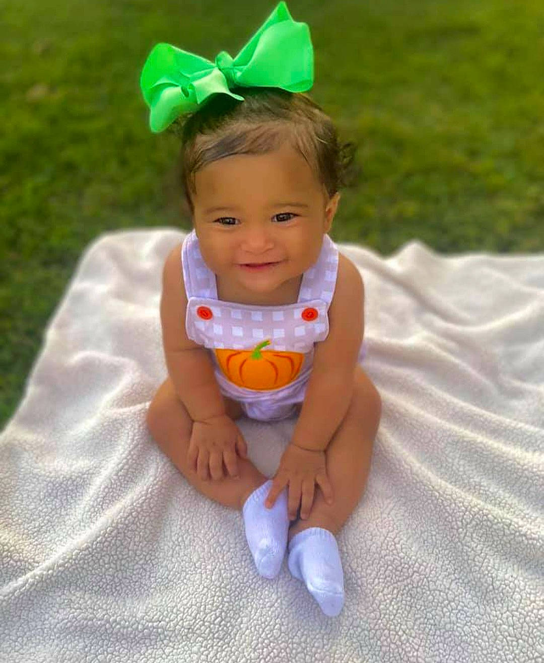 Amiyah joined the competition — help win amazing prizes! baby, baby_products, baby_toddler_clothing, child, grass, hair_accessory, head, headband, headgear, joy, person, play, product, skin, smile, toddler