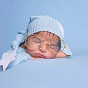 Pavish joined the competition — help win amazing prizes! baby, sleeping, glasses, blue, hat, knit, star, soft, blanket, closeup, face, cute, peaceful, infant, portrait, child, resting, cozy, newborn, headwear