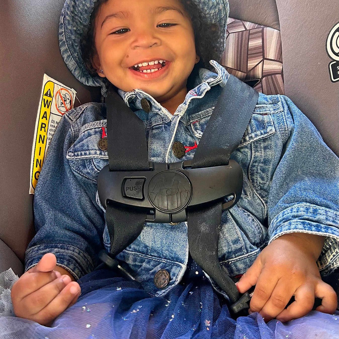 Paisley joined the competition — help win amazing prizes! baby, babylaughing, blade, child, clothing, coat, face, female, girl, happy, hat, head, jacket, jeans, pants, person, photography, portrait, sitting, smile
