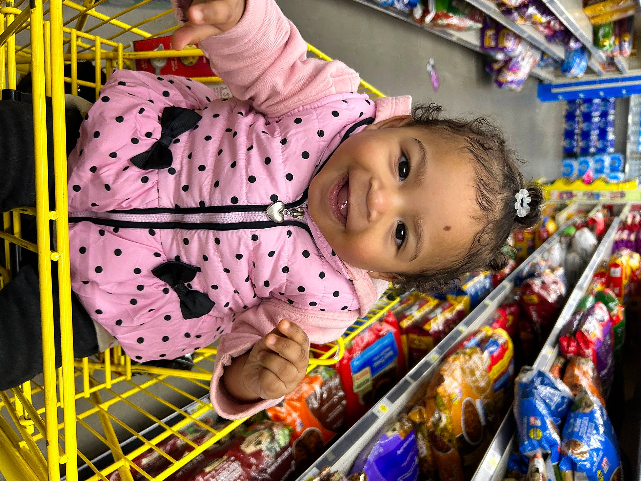 Paisley joined the competition — help win amazing prizes! baby, baby_toddler_clothing, building, child, convenience_store, customer, event, fun, happy, joy, leisure, pattern, person, retail, room, shelf, smile, toddler, yellow