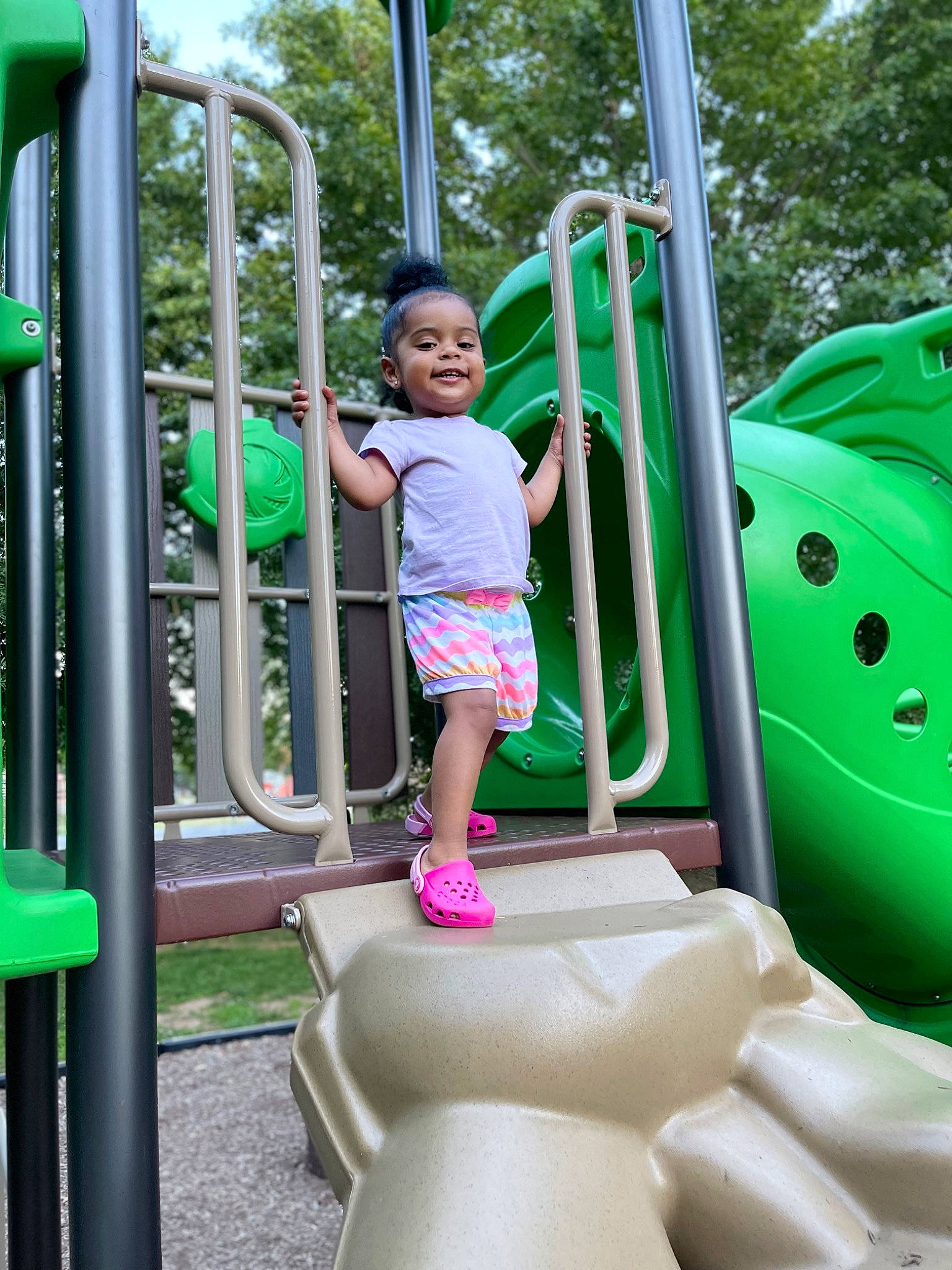 Adeline joined the competition — help win amazing prizes! baby_toddler_clothing, child, chute, city, fun, green, joy, leisure, outdoor_play_equipment, outdoor_recreation, person, photograph, play, playground, playground_slide, recreation, shorts, t_shirt, toddler, tree